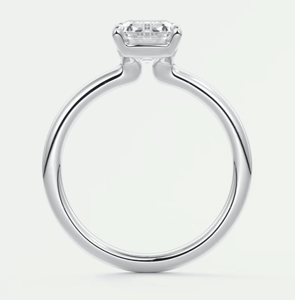 18-karat white gold engagement ring with a princess-cut diamond.