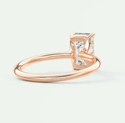 Rose gold princess cut diamond engagement ring with a square-shaped stone.