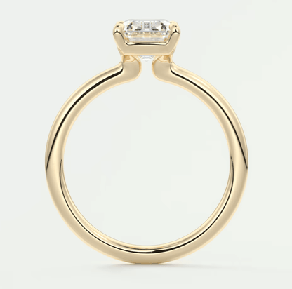18-karat yellow gold engagement ring with a princess-cut diamond.