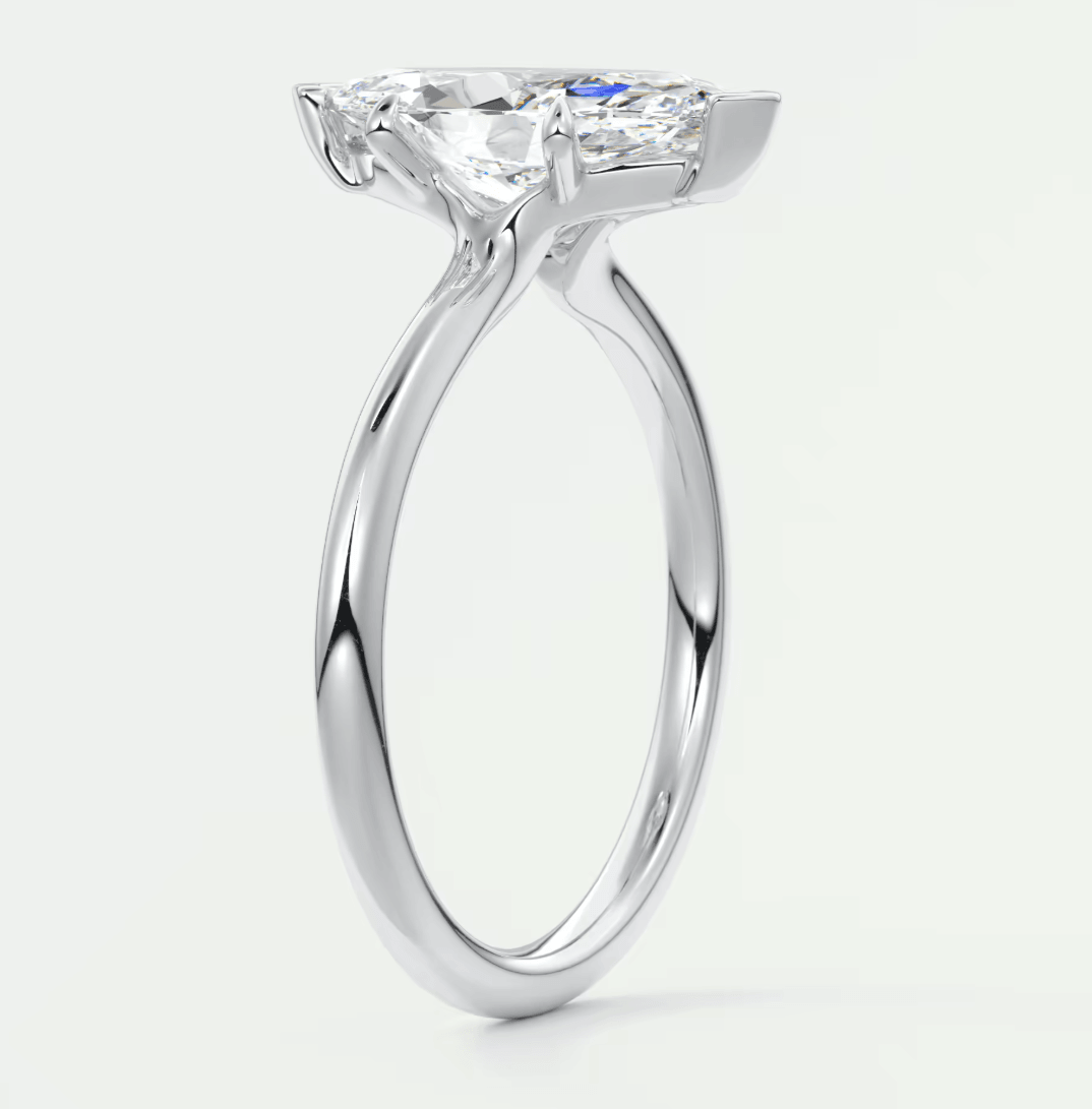 18-karat white gold engagement ring with a cushion-cut diamond.