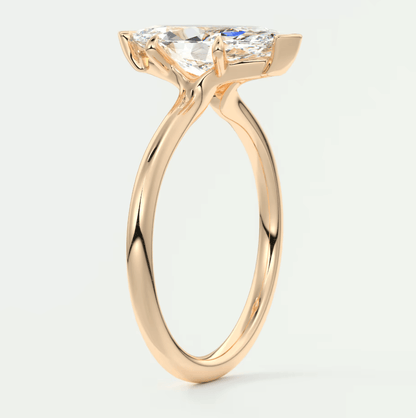 18k rose gold engagement ring with a princess cut diamond.