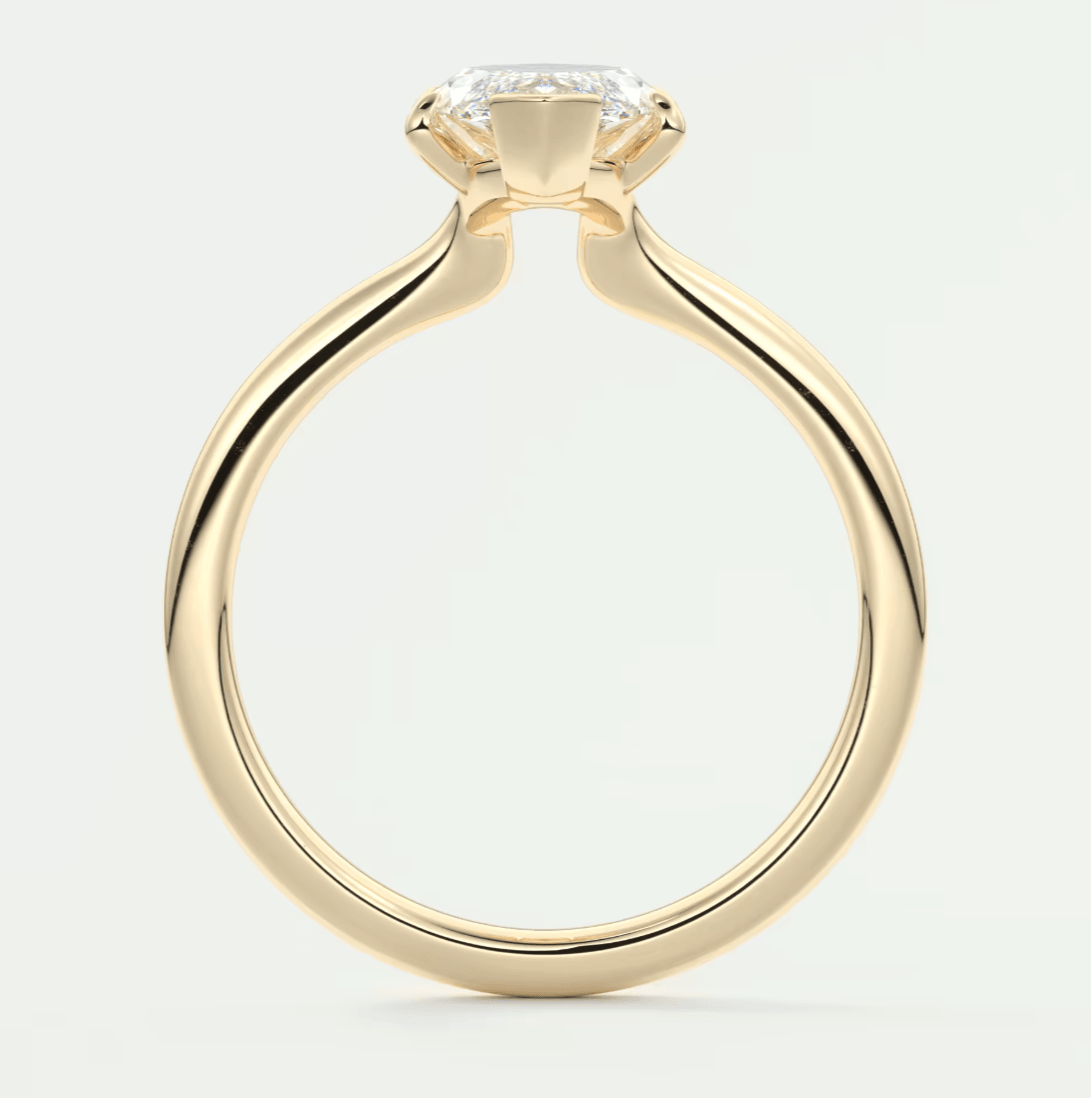 18-karat yellow gold engagement ring with a princess-cut diamond.