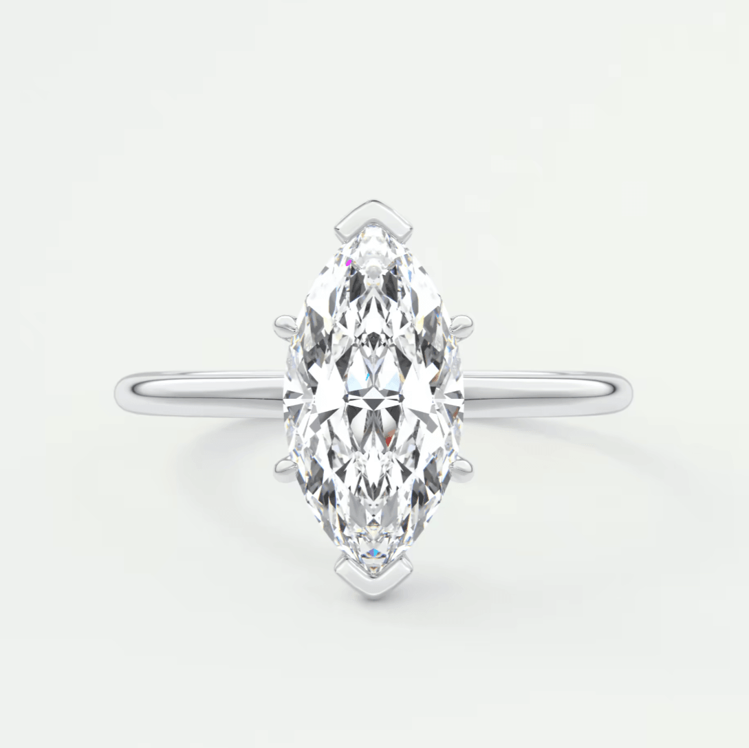 Marquise-cut diamond engagement ring with white gold band and prong setting.