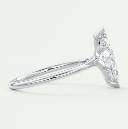 18k white gold engagement ring with a marquise-cut diamond and small round diamonds.