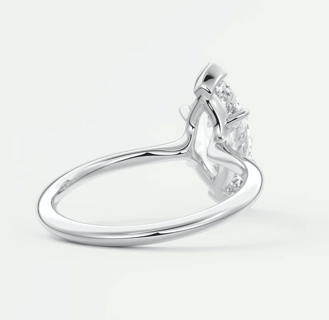 18-karat white gold engagement ring with a princess-cut diamond.