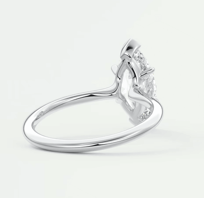 18-karat white gold engagement ring with a princess-cut diamond.