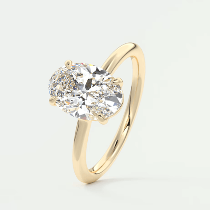 18-karat yellow gold solitaire diamond engagement ring.