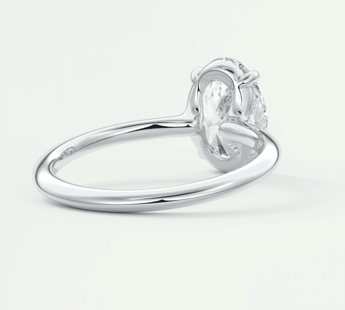 18k white gold engagement ring with a marquise-cut diamond.