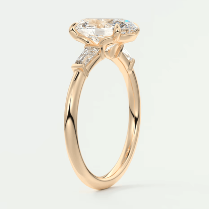 18k yellow gold engagement ring with a marquise-cut diamond and small diamonds on the band.
