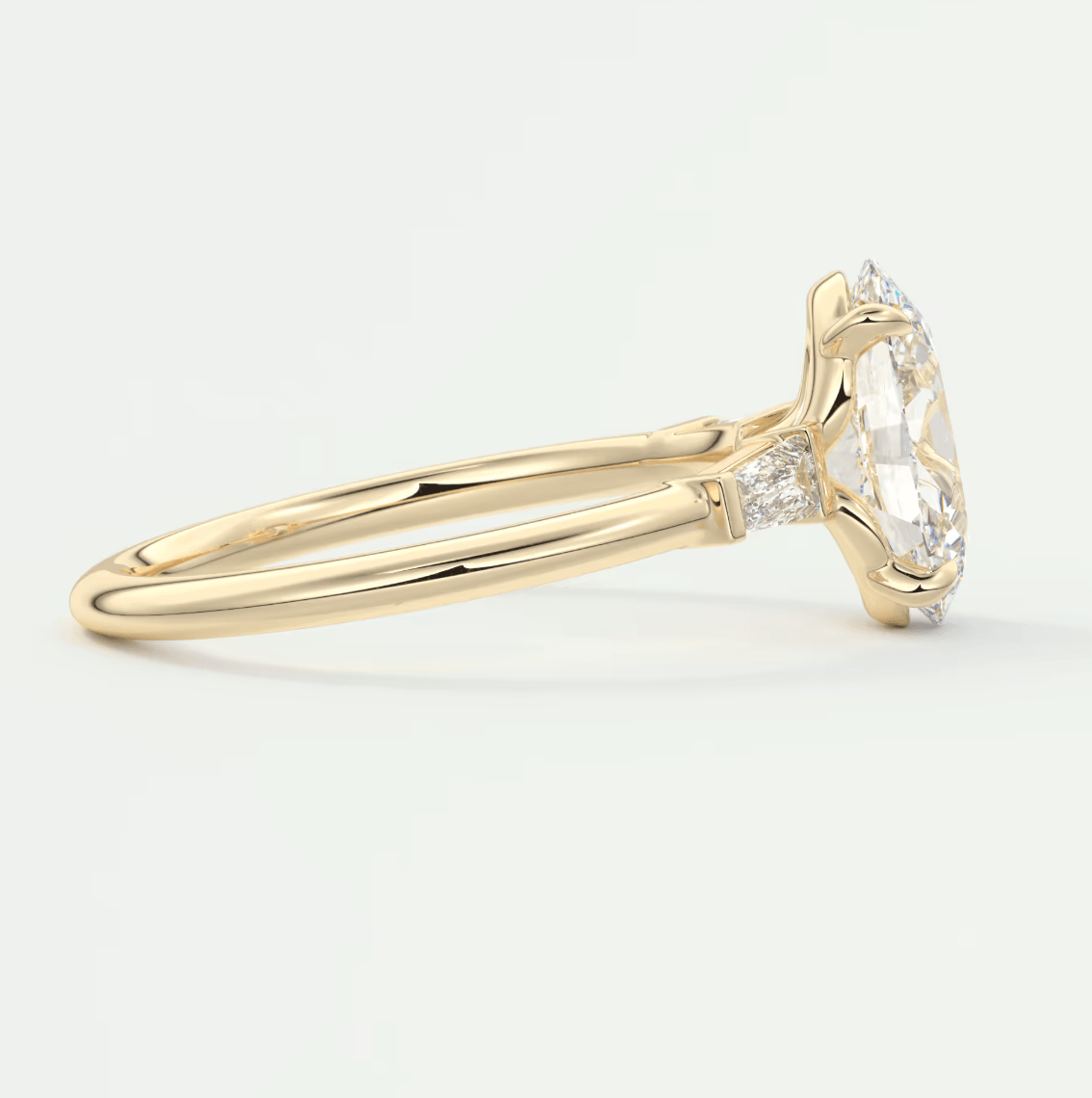 18k yellow gold engagement ring with a cushion-cut diamond and small diamonds on the band.