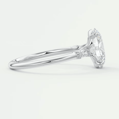 18-karat white gold engagement ring with a round diamond center stone and small diamonds on the band.