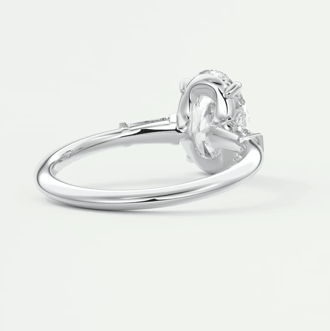 Silver diamond engagement ring with a solitaire design and prong setting.