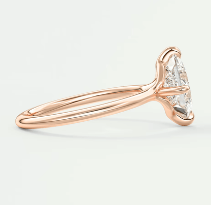 18k rose gold engagement ring with marquise diamond.