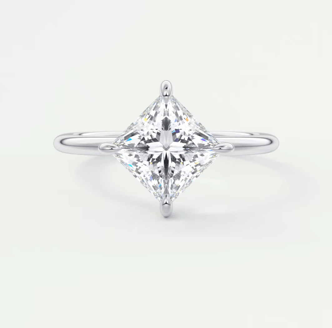 Princess cut diamond engagement ring with white gold band.