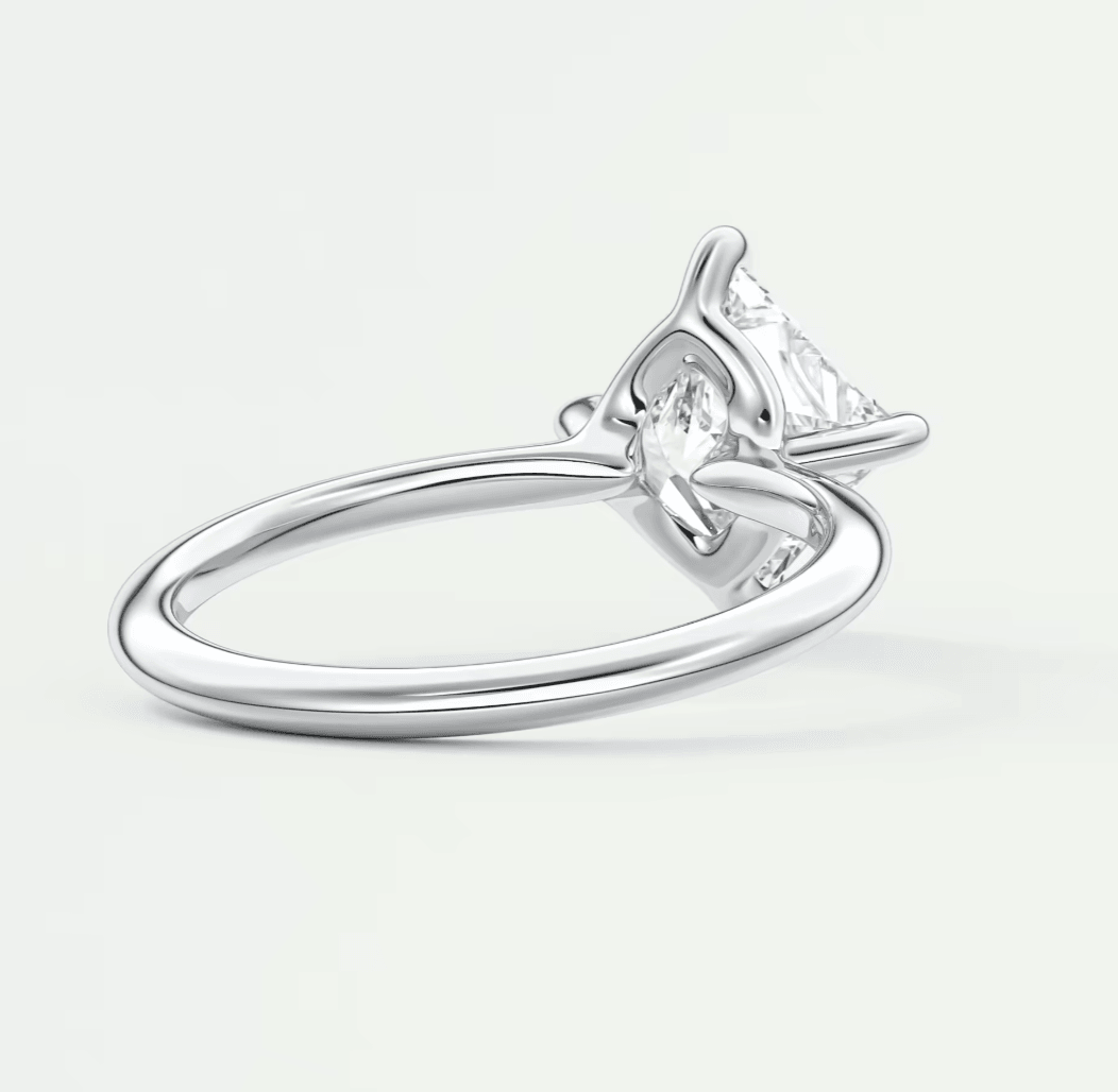 White gold diamond engagement ring with a solitaire design and claw setting.
