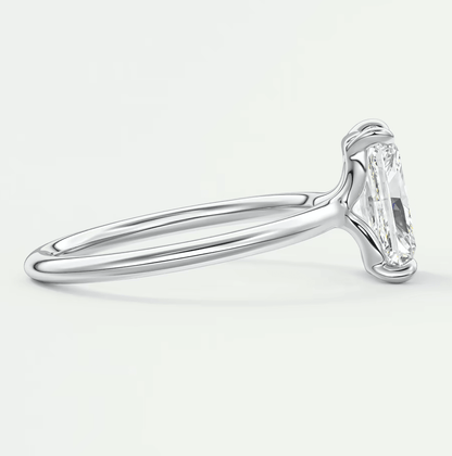 18-karat white gold engagement ring with a marquise-cut diamond.