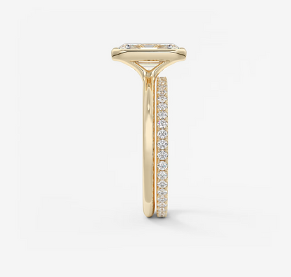 Gold ring with diamond accents on a white background