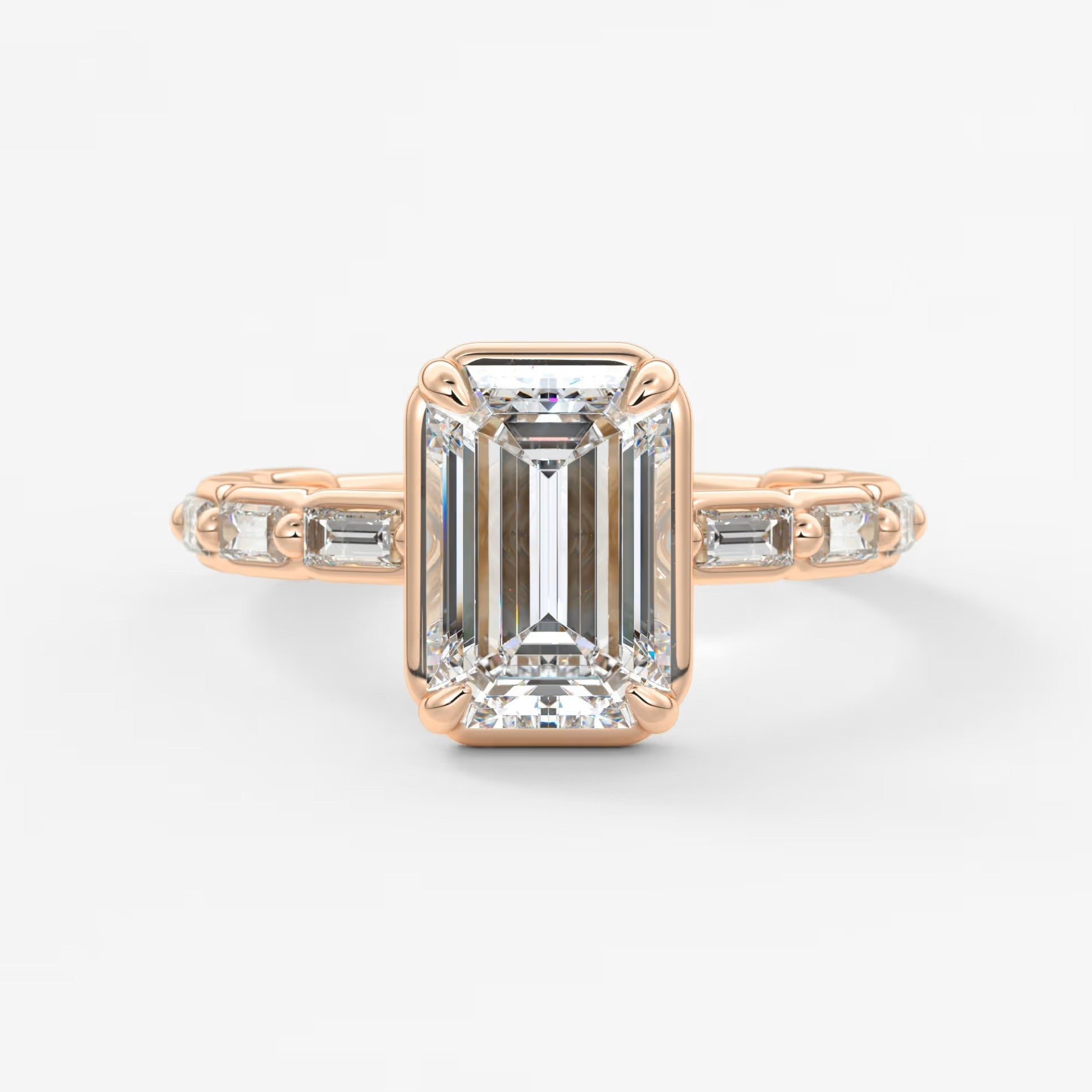 Isadora emerald bezel baguette engagement ring