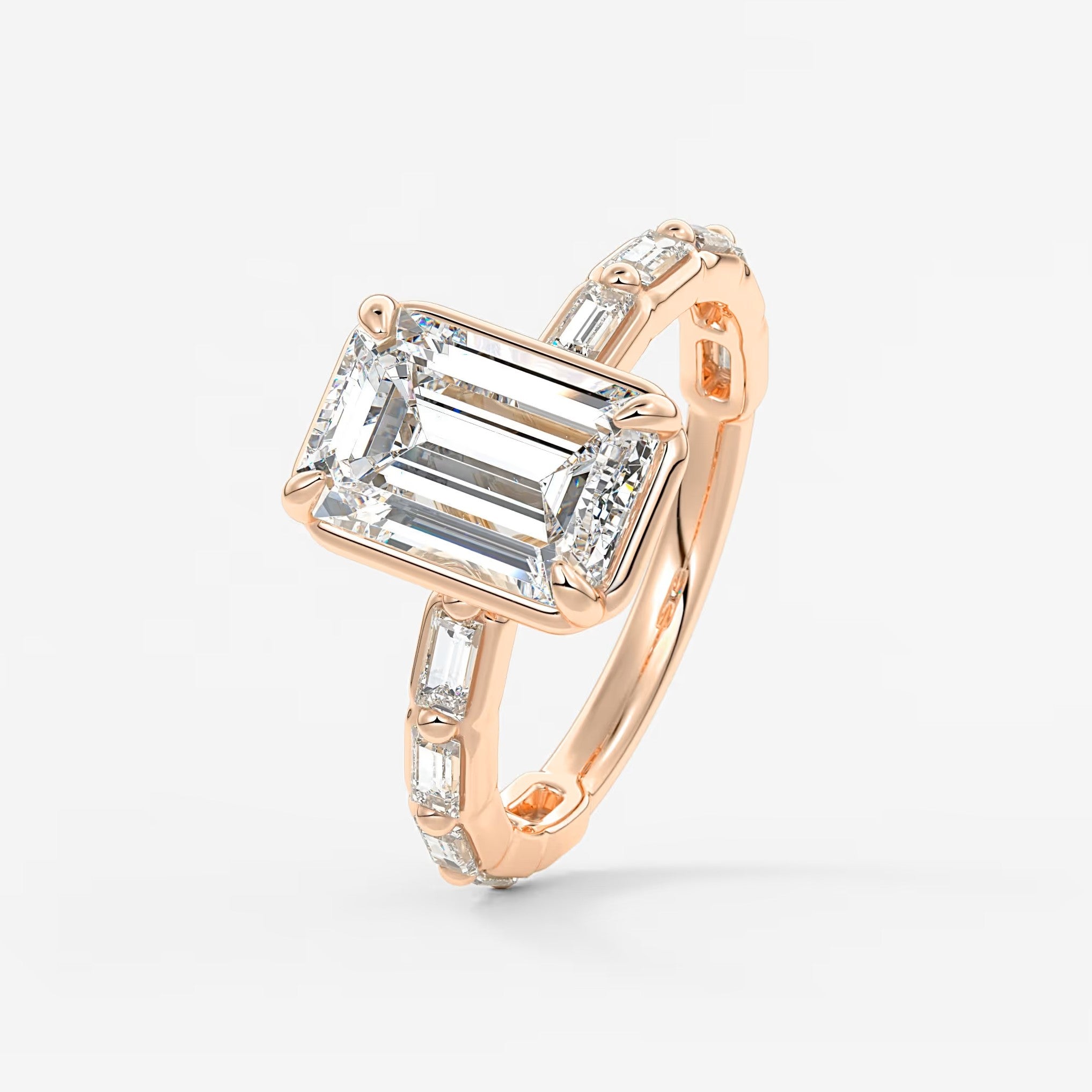 Isadora emerald bezel baguette engagement ring