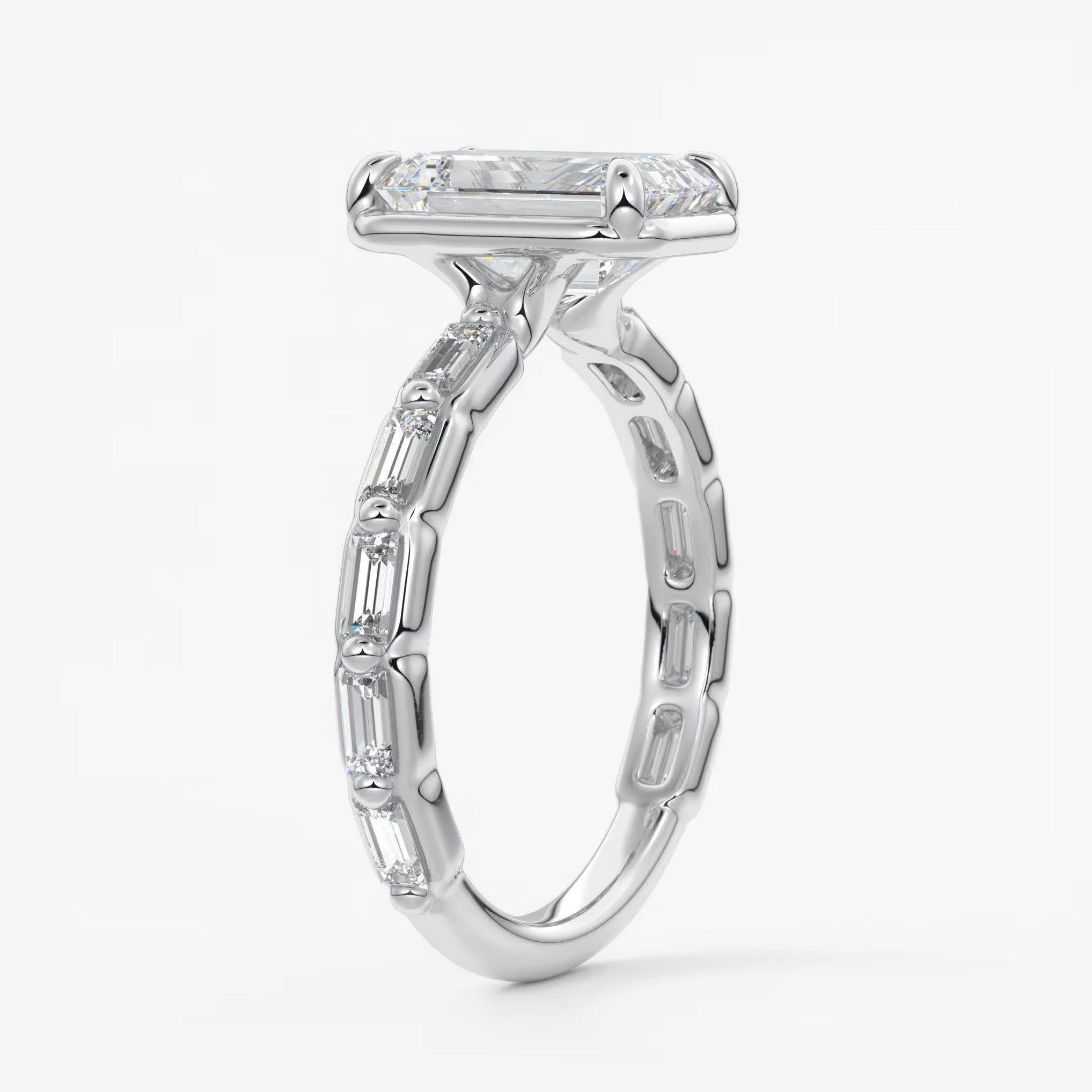 Isadora emerald bezel baguette engagement ring