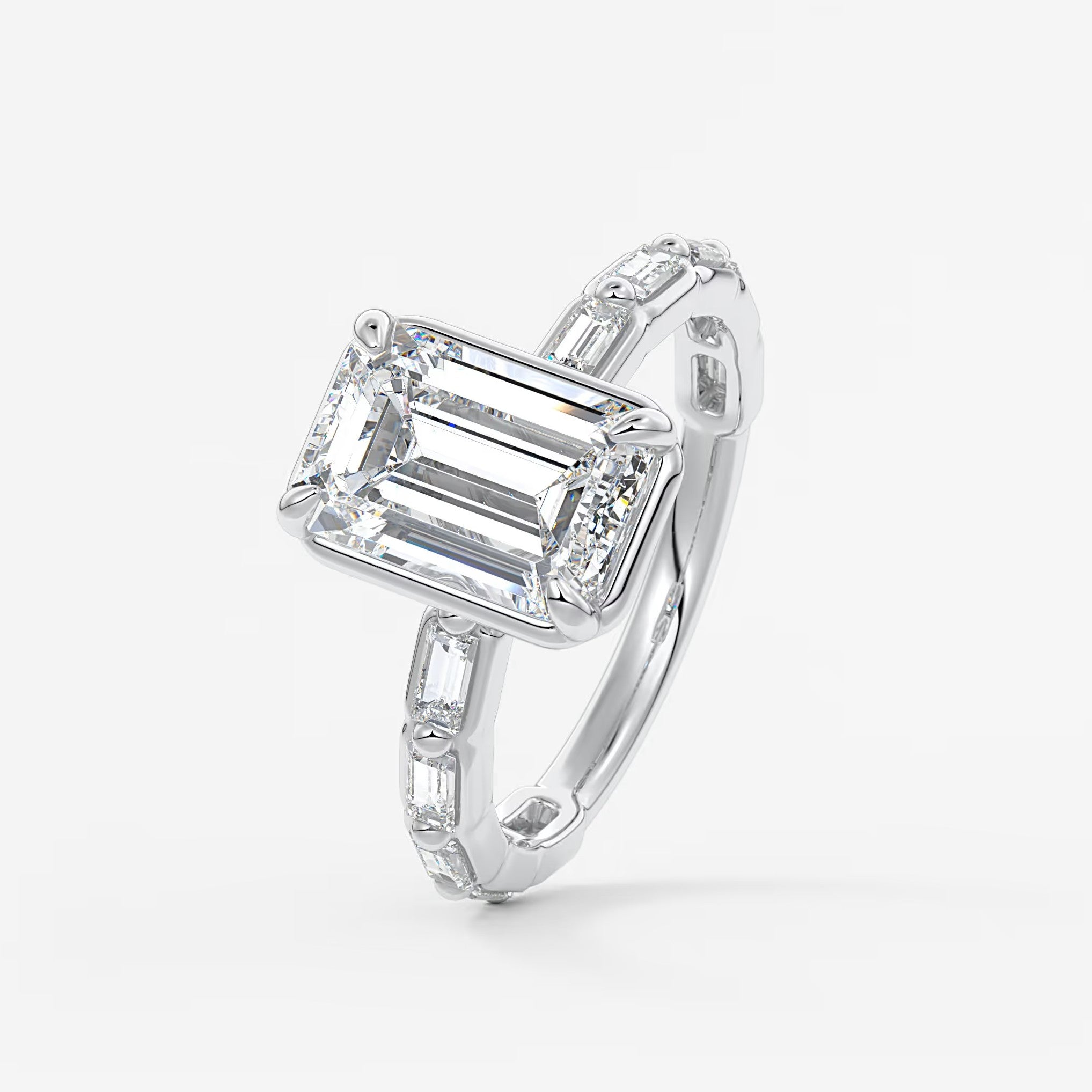 Isadora emerald bezel baguette engagement ring