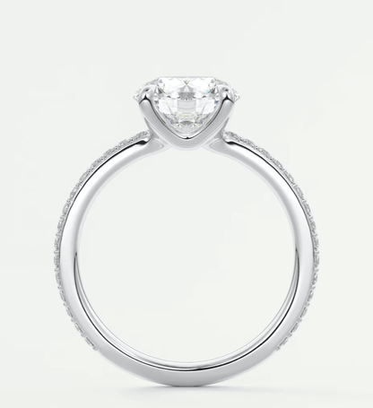 18k white gold engagement ring with a round diamond center stone and milgrain detailing.