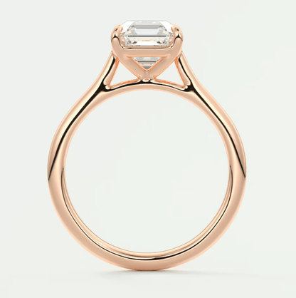 18-karat rose gold engagement ring with an emerald-cut diamond.