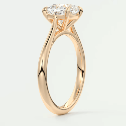 18-karat rose gold engagement ring with a princess-cut diamond.