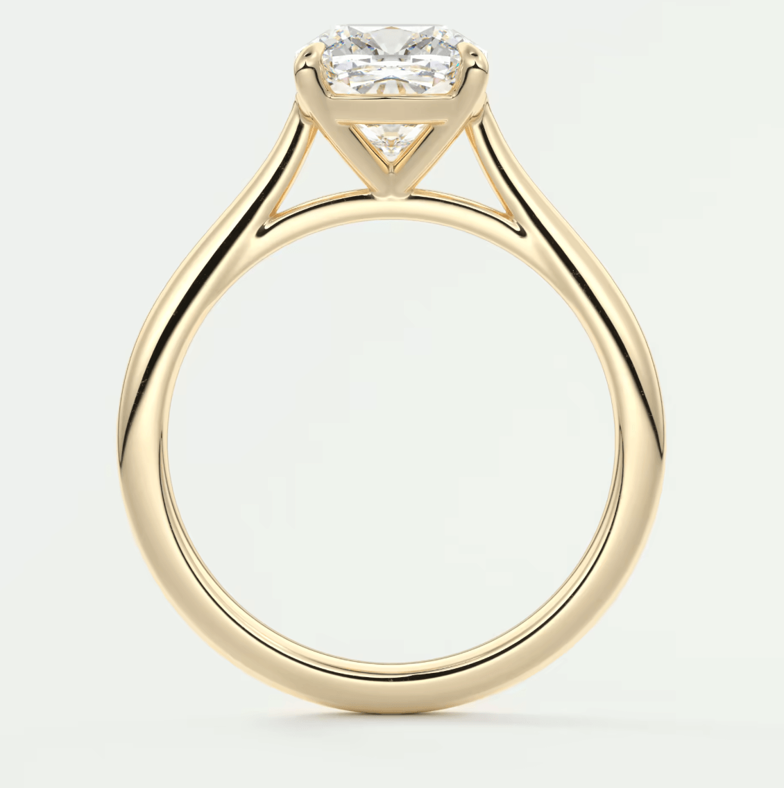 18k yellow gold engagement ring with a princess cut diamond.