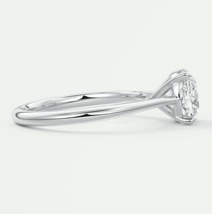 18k white gold diamond engagement ring with a marquise-cut center stone.