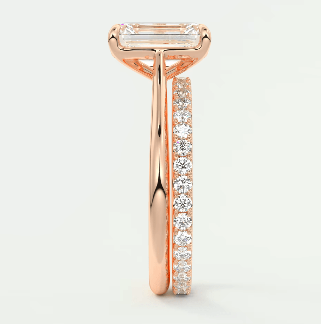 18k rose gold engagement ring with baguette and round diamonds.