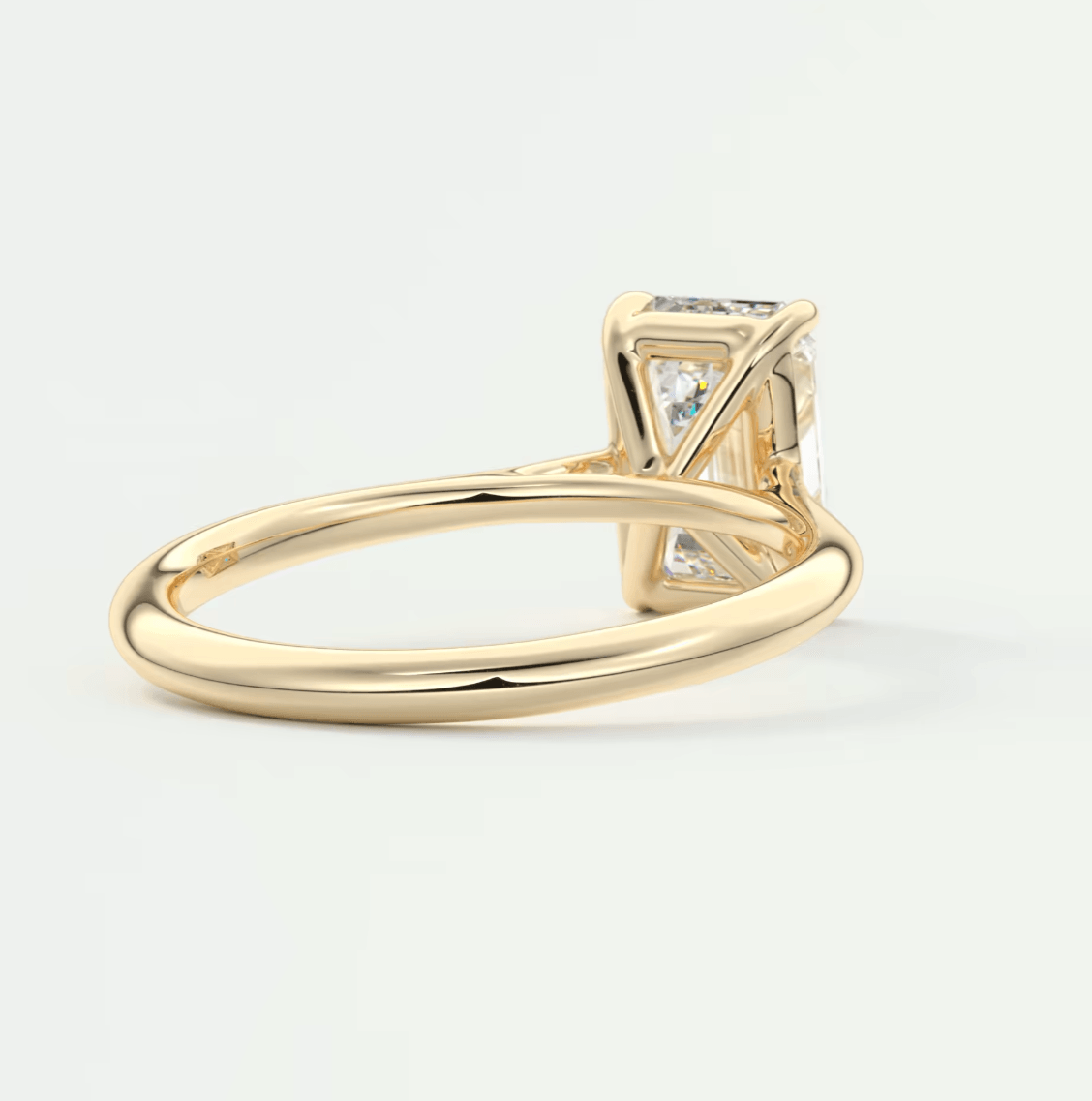 18k yellow gold princess cut diamond engagement ring.