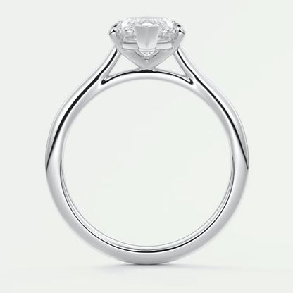 18-karat white gold solitaire engagement ring with a cushion-cut diamond.