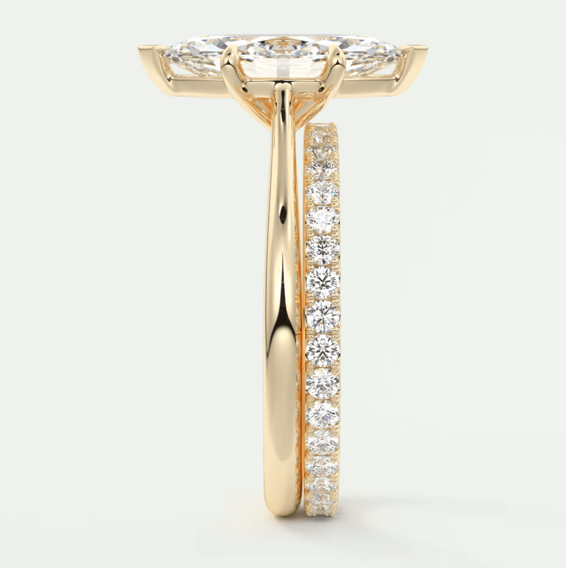 18k yellow gold diamond engagement ring with a princess cut center stone and channel set diamonds on the band.
