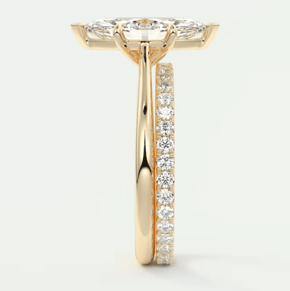 18k yellow gold diamond engagement ring with a princess cut center stone and channel set diamonds on the band.