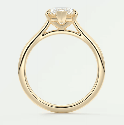 18-karat yellow gold engagement ring with a cushion-cut diamond.