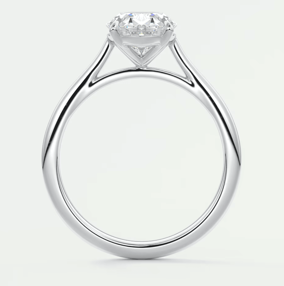 18k white gold solitaire diamond engagement ring with a round brilliant cut gem.
