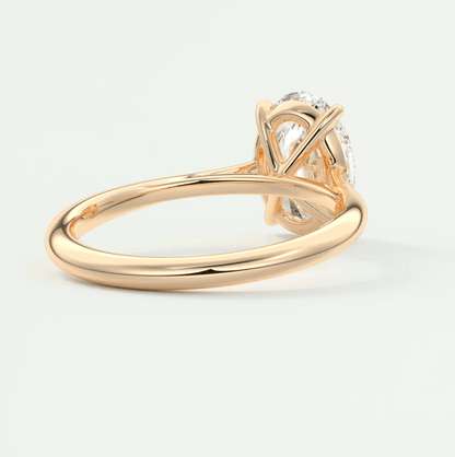 18-karat rose gold engagement ring with a marquise-cut diamond.