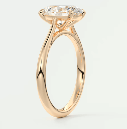 18-karat rose gold engagement ring with a marquise-cut diamond.
