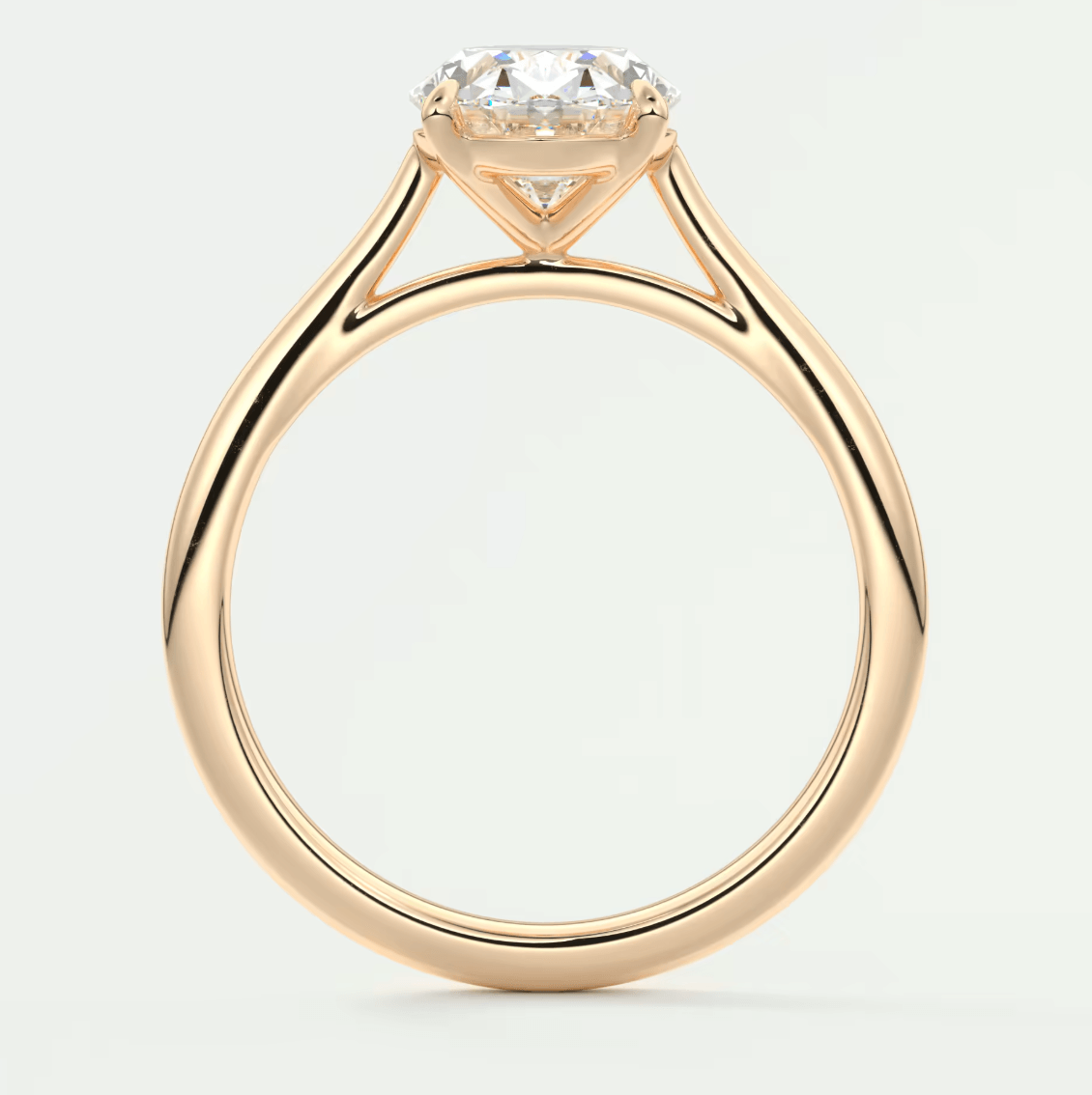 18k rose gold engagement ring with a round diamond.