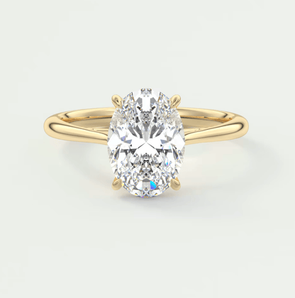 18k yellow gold oval diamond engagement ring with a solitaire design.