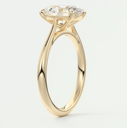 18k yellow gold engagement ring with a cushion-cut diamond and small round diamonds set in the band.