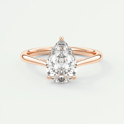 Rose gold pear-shaped diamond engagement ring with a classic solitaire design.
