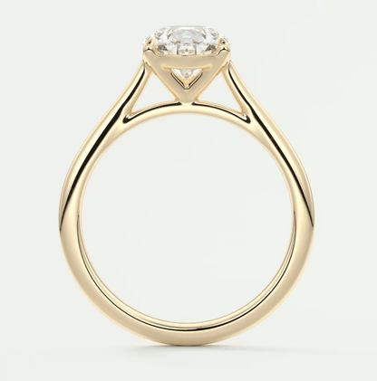 18-karat yellow gold engagement ring with a round diamond center stone.