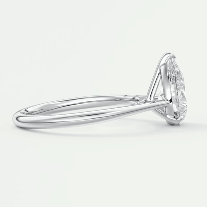 18-karat white gold diamond engagement ring with a marquise-cut center stone and small diamonds on the band.