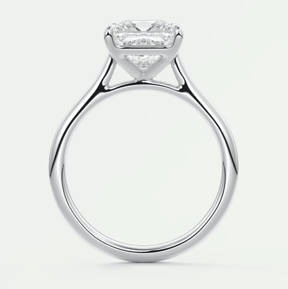 18k white gold princess cut diamond engagement ring with baguette side stones.