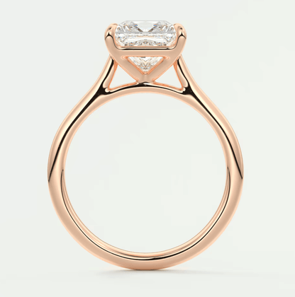 Rose gold princess cut diamond engagement ring with a twisted band design.