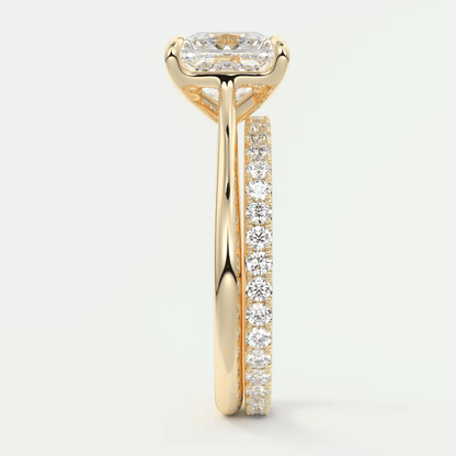 18k yellow gold engagement ring with a princess cut diamond and channel set diamonds on the band.
