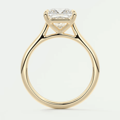 18-karat yellow gold engagement ring with a princess-cut diamond.