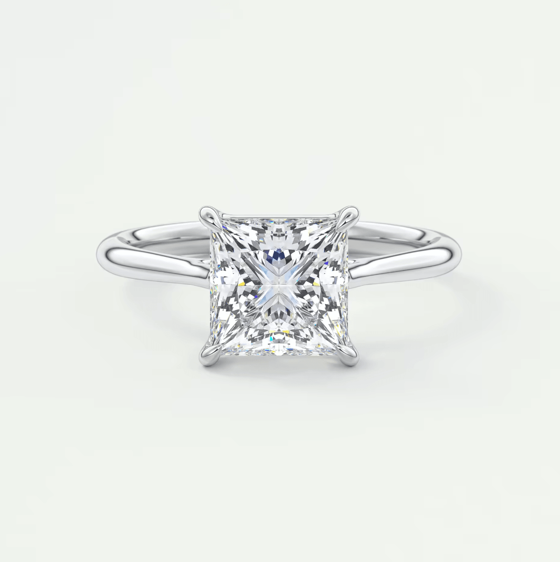 Princess cut diamond engagement ring with white gold band.